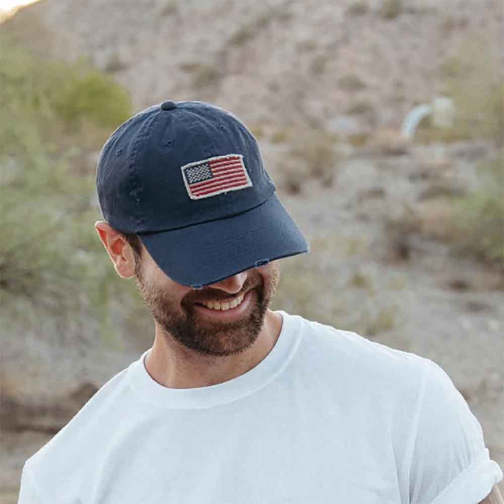DPCDistressedTwillCapwithFrayedUSAFlagnavyonmodel.jpg