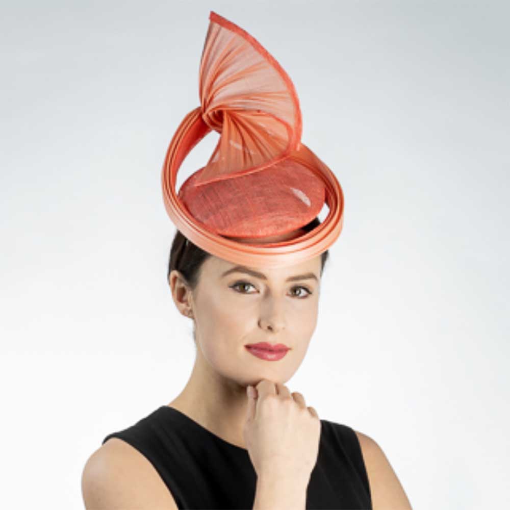 FancySculpturalSinamayFascinatorHeadpiece-KaKyCOwomenwearingcoralhat.jpg
