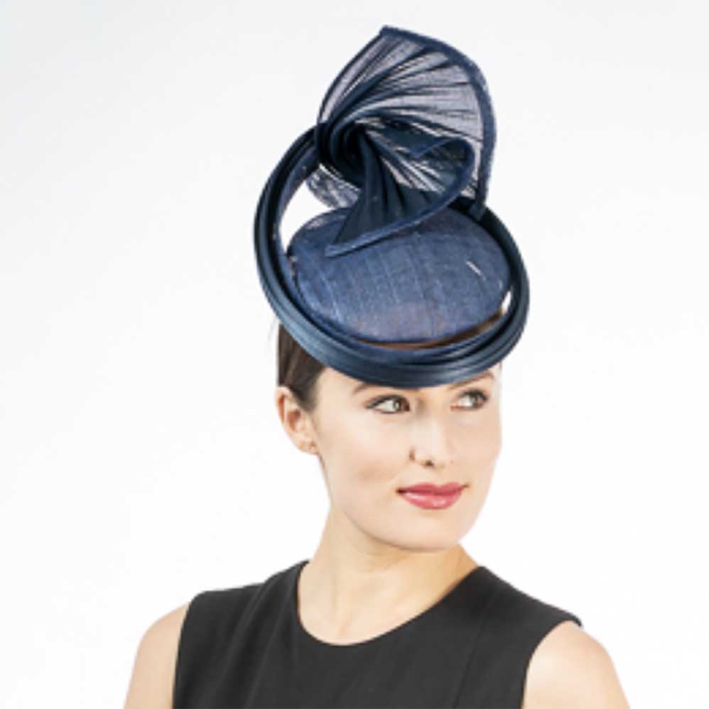 FancySculpturalSinamayFascinatorHeadpiece-KaKyCOwomenwearingnavyhat.jpg