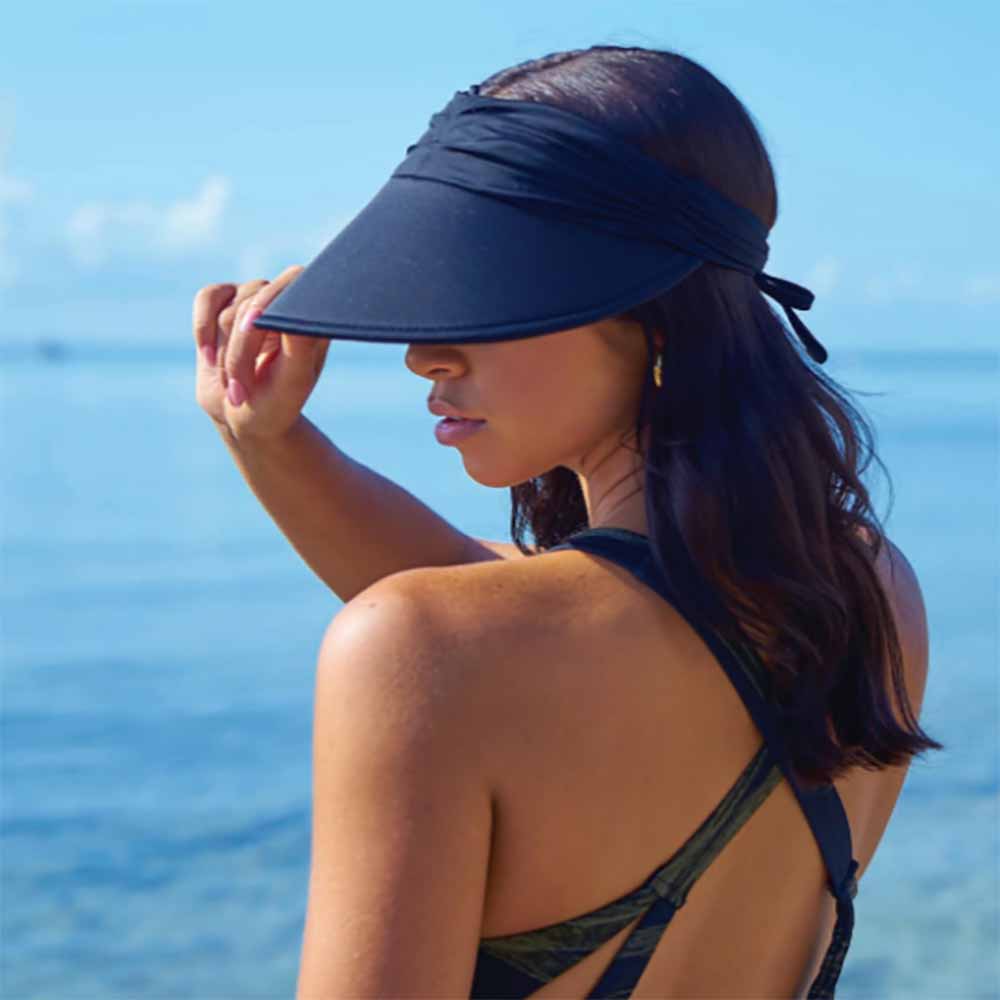 LycraSwimsuitSunVisorsinFashionColors-TropicalTrendswomenwearingnavyvisor.jpg