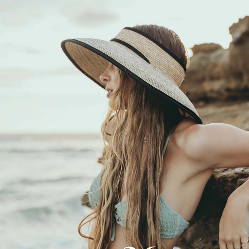 OpenCrownPalmVisorHatwithBlackTrim-MakaiHatCowomenwearingvisorhatonbeach.jpg