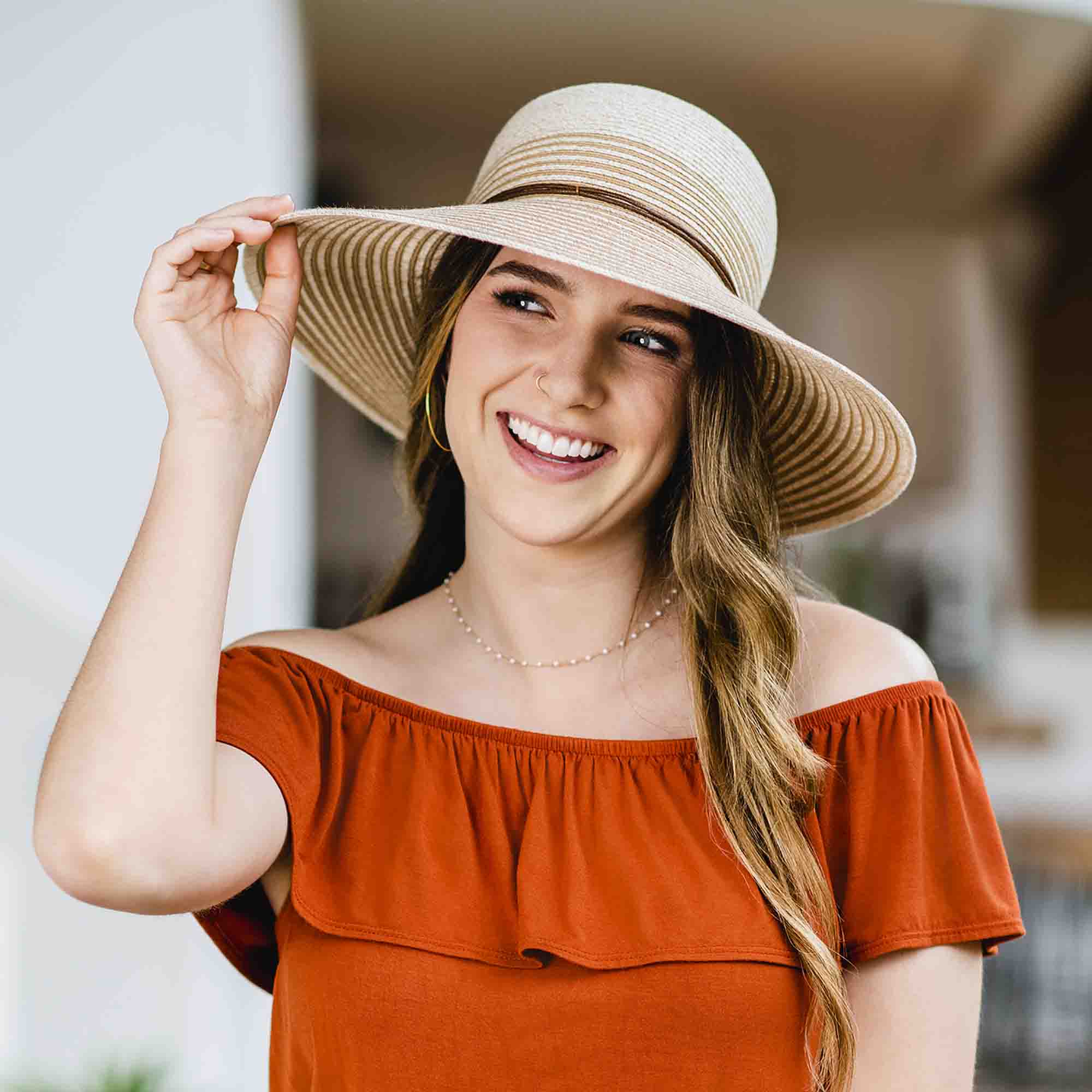 PetiteMarseilleWideBrimSunHat-WallarooHatsmodelwearingbeigehat.jpg