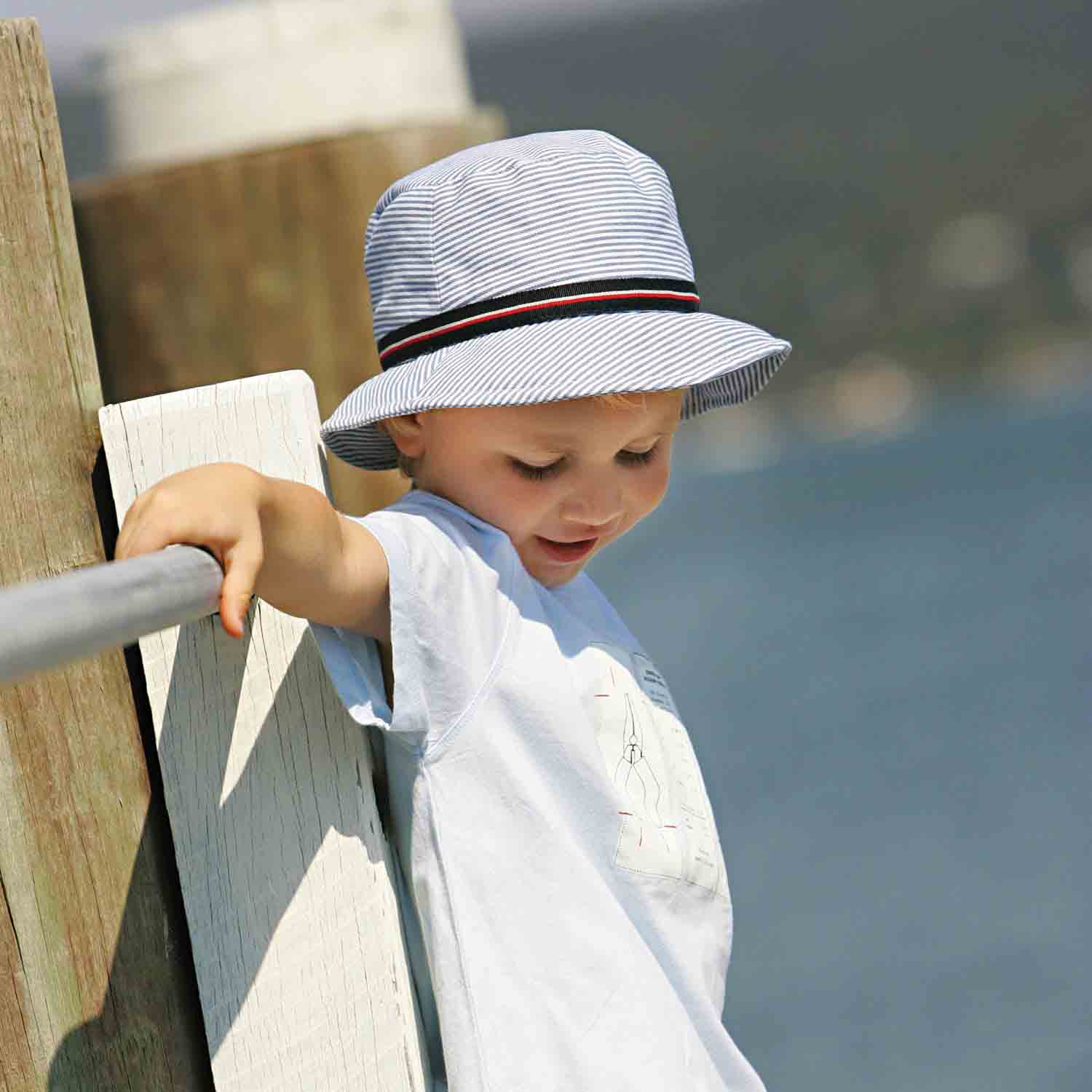 SawyerBucketHatforSmallHeads-WallarooHatsboywearsbluesearsuckerhat.jpg